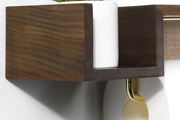 Est-ce qu'un porte papier toilette en bois réduit les odeurs ?